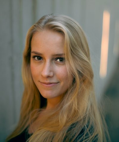 woman in black shirt smiling
