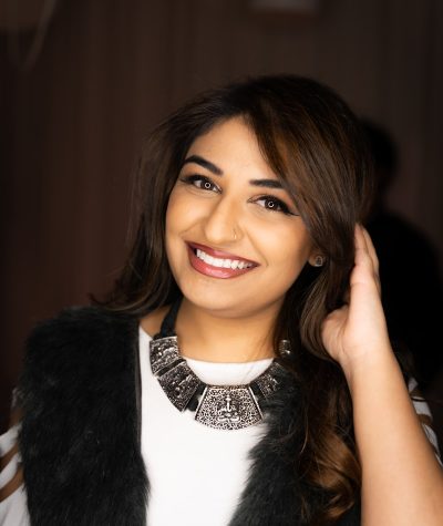 woman in black fur vest